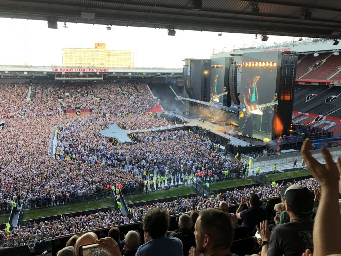 the stage and catwalk of the Rolling Stones show surrounded by a massive crowd